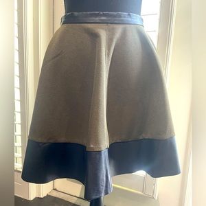 Boutique (Fabrik) olive green skirt with black leather trim.